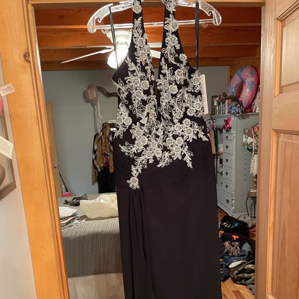 Tiffany Designs black formal prom dress. Deep v. Slit. Size 10